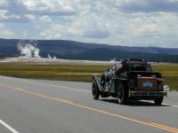 The 1929 Bentley cruises past geysers and a buffalo herd. - TW